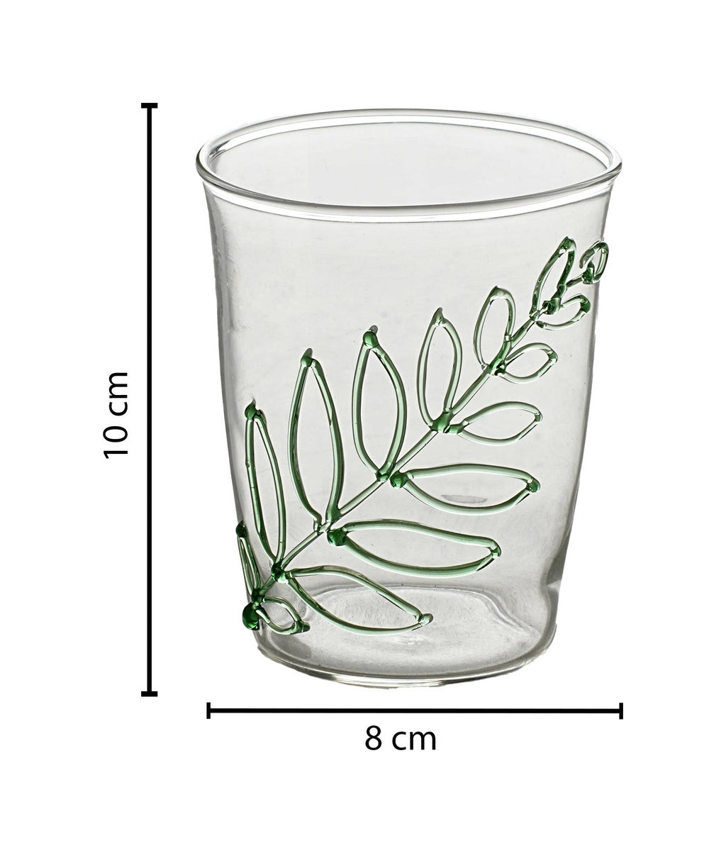 Glass with green leaf drawing