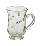 Tea cup with green dots and handle